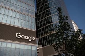 Google logo on the exterior of a glass office building