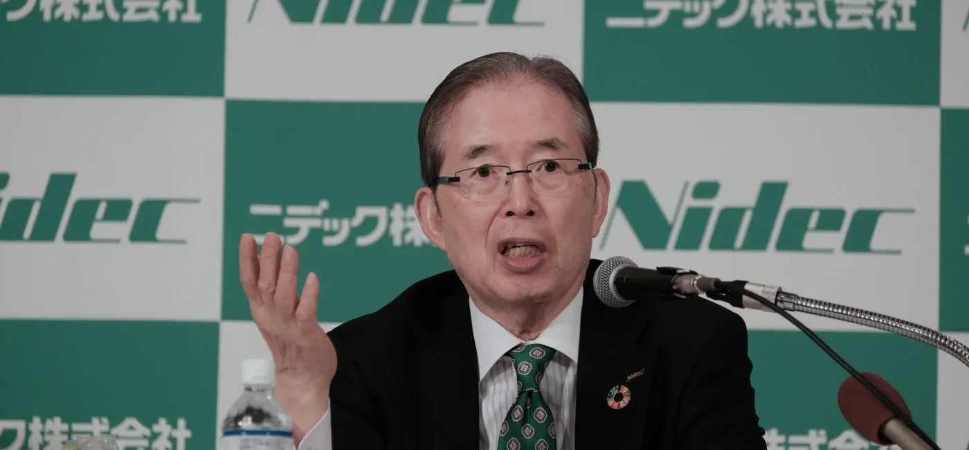Nidec executive speaking at a press conference