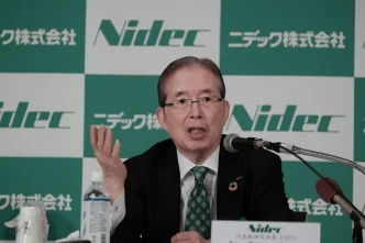 Nidec executive speaking at a press conference